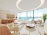 Amplo living integrado com vista mar 