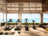 Studio fitness equipado. Aprecie a vista para o mar.